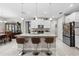 Bright kitchen with granite counters, stainless steel appliances, and a large island with bar seating at 1470 Atwater Dr, North Port, FL 34288