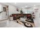 Inviting living room featuring a plush sectional sofa, modern rug, and ample natural light at 1470 Atwater Dr, North Port, FL 34288