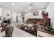 Spacious living room with tile floors, a comfortable sectional sofa, and stylish decor at 1470 Atwater Dr, North Port, FL 34288