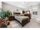 Bright main bedroom showcasing a dark wood bed, dresser, and a serene, relaxing ambiance at 1470 Atwater Dr, North Port, FL 34288