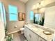 Bathroom with granite countertops, white cabinets, shower/tub and neutral colors at 15155 Scarlet Oak Ct, Punta Gorda, FL 33955