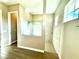 Modern bathroom with a glass-enclosed shower and tiled walls at 15155 Scarlet Oak Ct, Punta Gorda, FL 33955