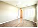 Bright bedroom with hardwood floors, closet, and neutral wall color at 15155 Scarlet Oak Ct, Punta Gorda, FL 33955