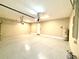 Spacious and clean garage with epoxy flooring and ample room for parking and storage at 15155 Scarlet Oak Ct, Punta Gorda, FL 33955