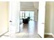 View from doorway into the open plan living room featuring luxury floors, and sliding doors to the lanai at 15155 Scarlet Oak Ct, Punta Gorda, FL 33955