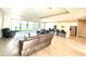 Bright and airy living space flowing into a modern kitchen and featuring large windows with water views at 15155 Scarlet Oak Ct, Punta Gorda, FL 33955