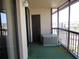 Enclosed balcony featuring a serene space with a door and scenic views through the large sliding windows at 21405 Olean Blvd # 605, Port Charlotte, FL 33952