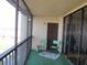 Balcony view with two chairs, carpeted floor, and screened windows at 21405 Olean Blvd # 605, Port Charlotte, FL 33952