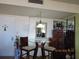 Cozy dining area with a glass table and mirrored accents, creating an inviting space for meals and entertaining at 21405 Olean Blvd # 605, Port Charlotte, FL 33952