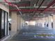 Interior of the parking garage showing parking spots and building supports at 21405 Olean Blvd # 605, Port Charlotte, FL 33952