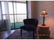 Comfortable chair with lamp in sitting area with sliding door access at 21405 Olean Blvd # 605, Port Charlotte, FL 33952