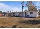 Shot of a home exterior with a lawn, driveway, and view of the front entrance at 215 Washington Ave, Englewood, FL 34223