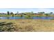 Lush backyard with waterfront views, perfect for relaxation and outdoor enjoyment at 2255 Easy St, Port Charlotte, FL 33952