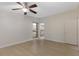 Spacious bedroom featuring a ceiling fan and ample natural light, complete with a large closet at 2255 Easy St, Port Charlotte, FL 33952