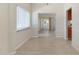 Bright dining room with natural light and views into the kitchen and bonus room at 2255 Easy St, Port Charlotte, FL 33952