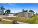Well-maintained single-story home featuring a carport and mature landscaping at 2255 Easy St, Port Charlotte, FL 33952