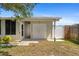 This is a closer view of the home's exterior featuring an outdoor entryway at 2255 Easy St, Port Charlotte, FL 33952