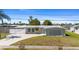 Charming single-story home with well-manicured lawn and mature landscaping at 2255 Easy St, Port Charlotte, FL 33952