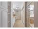 Hallway including lanai access to the right, and storage cabinets on the left at 2255 Easy St, Port Charlotte, FL 33952