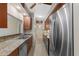 Modern kitchen features granite countertops, stainless steel appliances, and lots of storage at 2255 Easy St, Port Charlotte, FL 33952