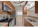 Well-equipped kitchen featuring granite countertops, stainless steel appliances, and lots of storage at 2255 Easy St, Port Charlotte, FL 33952