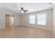 Open living space with wood floors, natural light from bright windows, and an overhead ceiling fan at 2255 Easy St, Port Charlotte, FL 33952