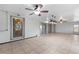 This sunroom has tile floors, lighting fixtures, and sliding glass doors for natural light at 2255 Easy St, Port Charlotte, FL 33952