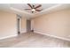 Comfortable bedroom featuring wood-look tile flooring and neutral-toned walls at 23283 Duchess Ave, Port Charlotte, FL 33954