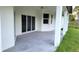 Rear covered patio featuring ceiling fan and ample space for outdoor seating at 23490 Macbeth Ct, Punta Gorda, FL 33980