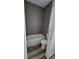 Bathroom features a tiled shower over tub and low-flow toilet at 23490 Macbeth Ct, Punta Gorda, FL 33980
