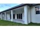 A lovely covered patio with columns and a ceiling fan for outdoor enjoyment at 23490 Macbeth Ct, Punta Gorda, FL 33980