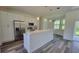 Bright kitchen featuring stainless steel appliances, white cabinets and eat-in peninsula at 23490 Macbeth Ct, Punta Gorda, FL 33980
