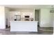 Bright kitchen features stainless steel appliances, white cabinets and eat-in peninsula at 23490 Macbeth Ct, Punta Gorda, FL 33980