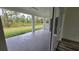Covered patio with tile flooring overlooks the backyard at 23490 Macbeth Ct, Punta Gorda, FL 33980