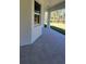 Covered patio with stone floors and windows at 23490 Macbeth Ct, Punta Gorda, FL 33980