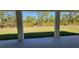 Covered patio overlooking backyard and wooded area at 23490 Macbeth Ct, Punta Gorda, FL 33980