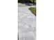 A close-up of gray paver stones laid as a walkway or driveway surface at 23490 Macbeth Ct, Punta Gorda, FL 33980