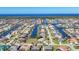 Stunning aerial view of waterfront homes along canals with ocean backdrop on a sunny day at 2501 Rio Grande Dr, Punta Gorda, FL 33950
