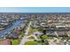 Scenic aerial view of waterfront houses with canal access and lush landscaping on a sunny day at 2501 Rio Grande Dr, Punta Gorda, FL 33950