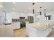 Bright kitchen featuring stainless steel appliances, large island, and stylish backsplash at 2501 Rio Grande Dr, Punta Gorda, FL 33950