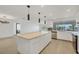Open kitchen layout featuring stainless steel appliances, large island, and water view at 2501 Rio Grande Dr, Punta Gorda, FL 33950