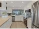 Modern kitchen featuring stainless steel appliances, island, and sleek design at 2501 Rio Grande Dr, Punta Gorda, FL 33950