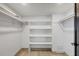 Spacious walk-in closet with built-in shelving and ample storage space at 2501 Rio Grande Dr, Punta Gorda, FL 33950