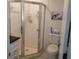 Clean bathroom featuring a tiled walk-in shower, a black granite countertop, and updated fixtures at 25100 Sandhill Blvd # I201, Punta Gorda, FL 33983