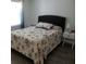 Cozy bedroom featuring stylish coastal-themed decor, including seashells, soft lighting, and a plush bed at 25100 Sandhill Blvd # I201, Punta Gorda, FL 33983