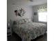 Comfortable bedroom with a coastal vibe, featuring a queen bed and seaside-inspired decor at 25100 Sandhill Blvd # I201, Punta Gorda, FL 33983