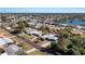 Aerial shot of home with screened-in lanai, landscaping, and a view of the neighborhood at 2550 Ivanhoe St, Port Charlotte, FL 33952