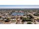 An aerial view of the single-Gathering home with a lake view and lush green landscape at 2550 Ivanhoe St, Port Charlotte, FL 33952