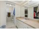 Well-lit bathroom with vanity, sink, and a separate toilet room, offering functionality and cleanliness at 2550 Ivanhoe St, Port Charlotte, FL 33952