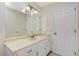 Bathroom featuring a large vanity, a large mirror with lighting and a neutral color palette at 2550 Ivanhoe St, Port Charlotte, FL 33952